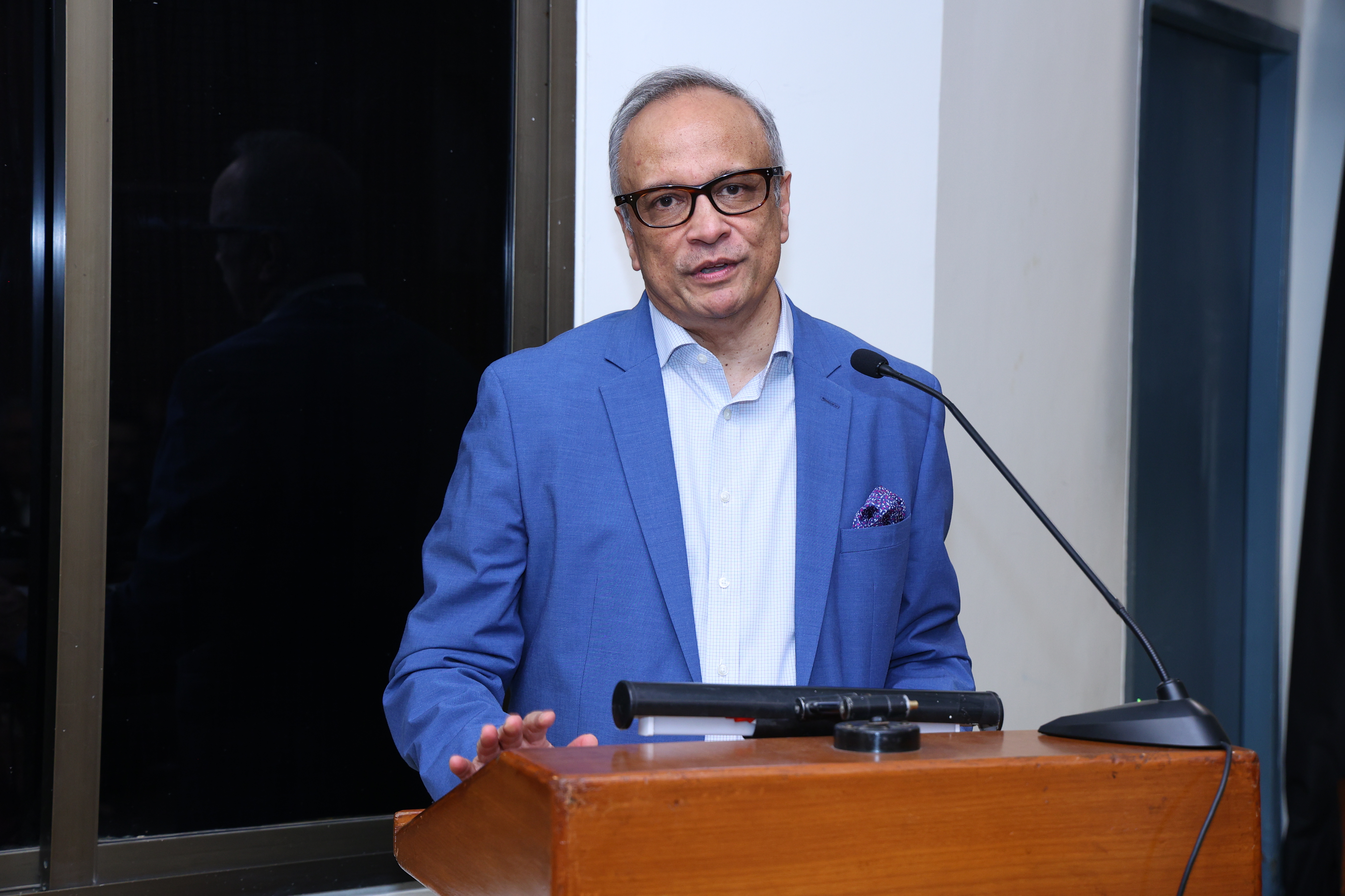 Samiran Sen Gupta giving the introduction at the IIC book launch